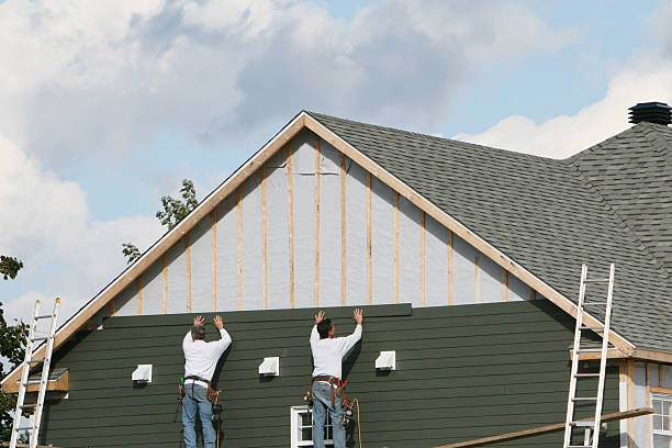 Professional Siding technician working in Fairview, NJ